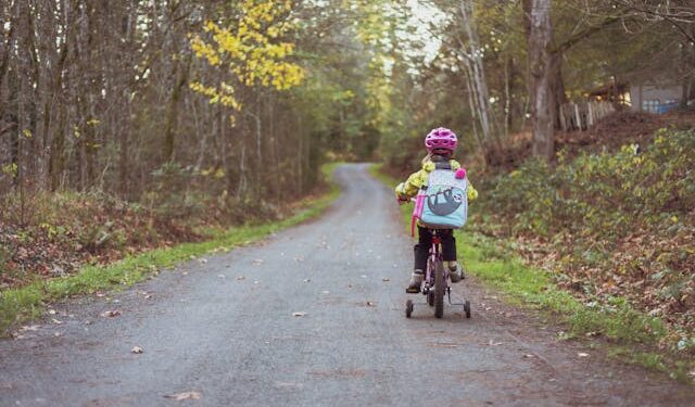 Toddler Riding Bicycle on Road