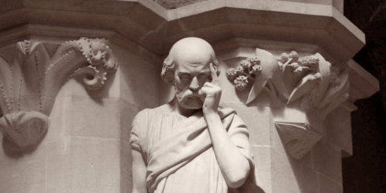 Roman-style statue pointing to its head, symbolizing reflection and the hidden cost of self-sacrifice.